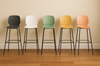 Aarhus counter stool, collection of the available colours shown in a row in a modern office.