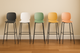 Aarhus counter stool, collection of the available colours shown in a row in a modern office.