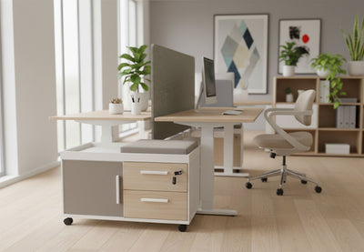 Moda Mobile Storage Cabinet in a modern office interior with oak flooring, beige walls and tall windows, showcasing its compact two-drawer one-door design, fabric-upholstered door panel and mobile caster base; contemporary office storage solution for flexible, space-efficient workspace organisation.